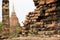 Overgrown old brick wall sukhothai temple ruins