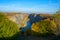 Overgrown quarry stone at sunset