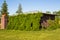 Overgrown Typical Rural house at sunny day