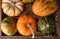Overhaed closeup of a variety of decorative gourds and pumpkins
