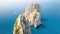 Overhead aerial view of Faraglioni from a drone, Capri. Famous rocks of Campania, Italy