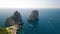 Overhead aerial view of Faraglioni from a drone, Capri. Famous rocks of Campania, Italy