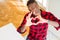 Overhead angle of handsome african american man smiling in love showing heart symbol and shape with hands