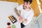 Overhead angle of young man eating sushi asian food using choopsticks