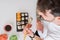 Overhead angle of young man eating sushi asian food using choopsticks