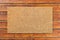 Overhead of blank doormat on the wood plank porch