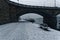 Overhead bridge over a dockyard and sea