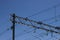 Overhead cable catenary train on a blue sky