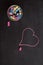 Overhead of chalkboard, chalk and heart shape drawing