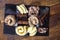 Overhead closeup shot of chocolate and vanilla ice cream scoops with slices of cake on the side