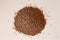 Overhead closeup shot of a pile of buckwheat lying on white background