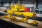 Overhead crane with magnetic grippers lifting steel sheets