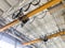 Overhead cranes inside industrial building. Bridge cranes inside hangar