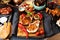 Overhead of dinner table. Assorted delicious grilled barbecue me