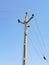 Overhead Electricity Line Pole Blue Sky. Electronic Cable Out Door