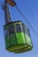 Overhead green cable car cabin