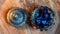 Overhead image of an open ornate glass pot filled with dice