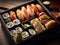 Overhead Japanese sushi food. Maki ands rolls with tuna, salmon, shrimp, crab and avocado.