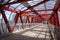 Overhead passage. Bolted steel beams. Painted in red. Interior