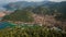 an overhead perspective of a town and a lake, providing a factual overview of their features and characteristics, Aerial view of