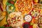 An overhead photo of an assortment of many different Mexican foods on a table