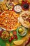 An overhead photo of an assortment of many different Mexican foods on a table