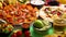 An overhead photo of an assortment of many different Mexican foods on a table