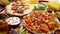 An overhead photo of an assortment of many different Mexican foods on a table