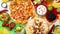 An overhead photo of an assortment of many different Mexican foods on a table