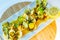 Overhead photo of clams in platter on wooden board on table