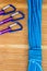 Overhead shot of blue climbing rope and quickdraws under the light