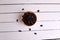 Overhead shot of a bowl of raisins on a wooden table