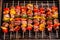 overhead shot of brazilian churrasco skewers on a grille