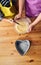 Overhead shot of a Caucasian mother teaching her son to cook and preparing the ingredients to make a cake