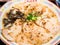 Overhead shot of cooked ramen on a plate with colorful ornaments