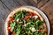 Overhead shot of a customized pizza with mozoralle, tomatoes and rucola, Brussels city, Belgium