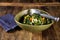 Overhead shot of delicious fresh salad vegetables with a stainless steel food tong