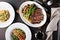 Overhead shot of a dinner table with steak and salmon