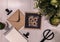 Overhead shot of a framed sunflower photo and an envelope on the table