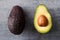 Overhead Shot Of Halved Avocado On Wooden Background