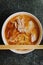 Overhead shot of a hot bowl of Ramen with wooden chopstick