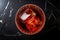 overhead shot of an ice-filled crystal glass with a negroni