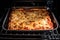 overhead shot of lasagna baking in the oven, with tantalizing aromas filling the air