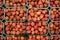 Overhead shot - lychee fruits in small plastic boxes, displayed on food market at Lewisham, London