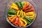 overhead shot of mixed charred bell peppers in a glass dish