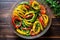 overhead shot of mixed charred bell peppers in a glass dish