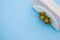 Overhead shot of a napkin holder with strawberry detail on blue background with space for your text