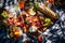 An overhead shot of a picnic blanket spread with delicious food on a sunny meadow