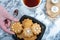 Overhead shot of a plate with homemade traditional Finnish gingerbread cookies and a teacup