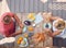 Overhead Shot Of Retired Couple Outdoors On Deck At Home Eating Breakfast